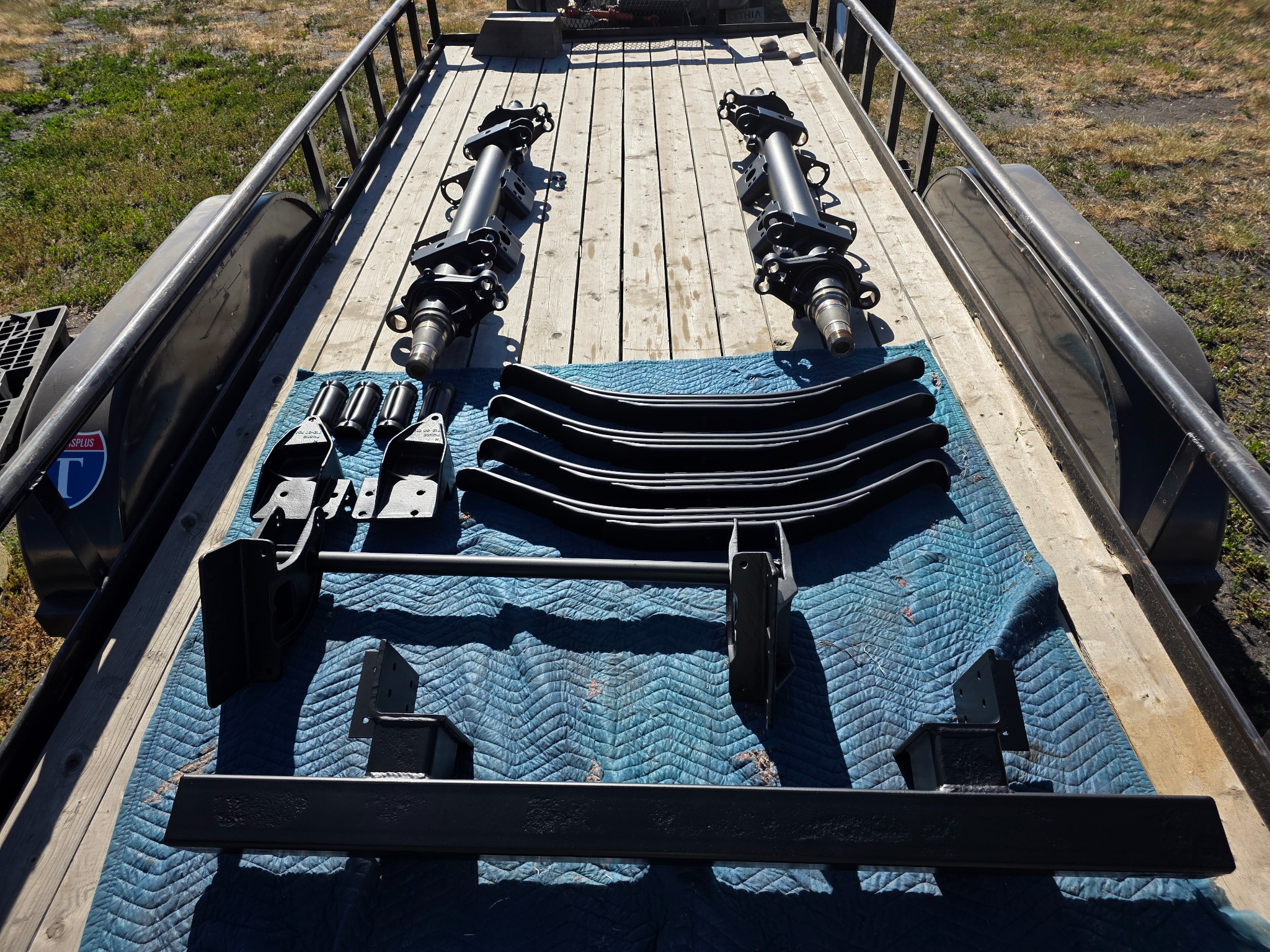 Trailer parts coated and laid out after sandblasting