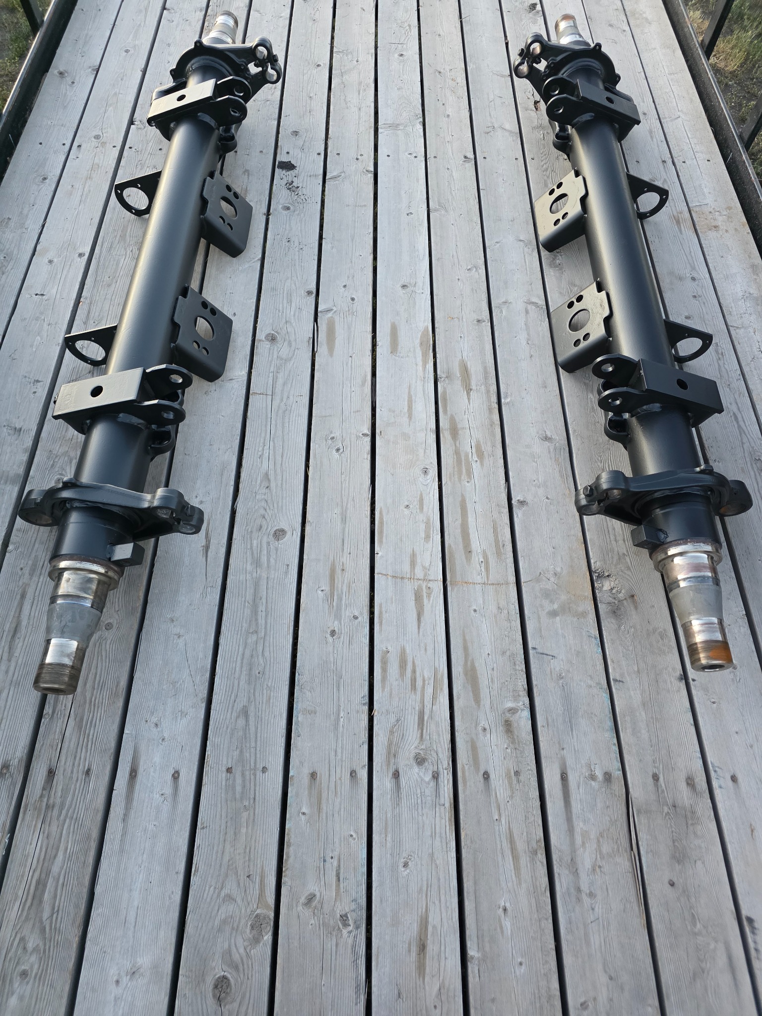 Powder coated trailer axles on wood deck